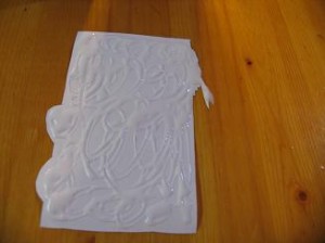 spread-glue-on-back-of-label