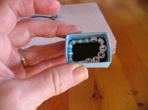 put-baby-bracelet-in-box