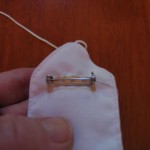 hand sew pin to back as shown