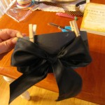 apply black ribbon and tie bow