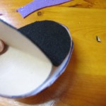 attach top half of felt circle to plastic circle