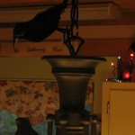 attach crow to top of light fixture