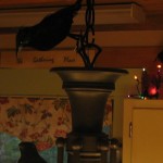 attach crow to top of light fixture