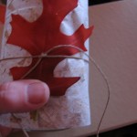 glue leaf on and tie a piece of cord around it