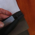 tape zipper down as shown