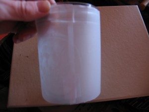 wrap paper around jar and tape