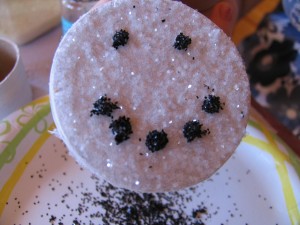 sprinkle black glitter on face