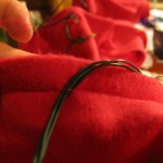 very carefully stitch over wires