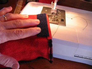 stitch a piece of velcro to the end of the  folded over portion