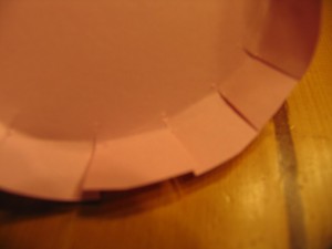 cut all around edge as shown and fold