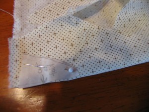 cut bottom piece from white fabric