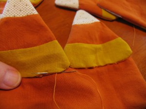 hand stitch candy corn to ends of runner