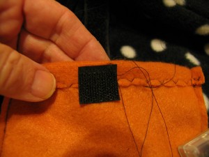 sew piece of velcro to top of pocket