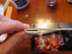 stick paper fastener through hole