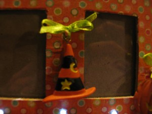 tie charms to dowels using narrow ribbon.