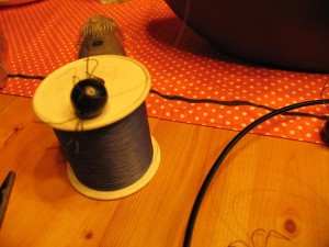 tie fishing line to each spider in different lengths