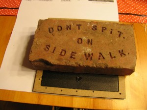 weigh down with brick