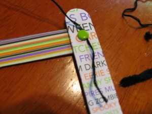 wrap string around paper fasterner