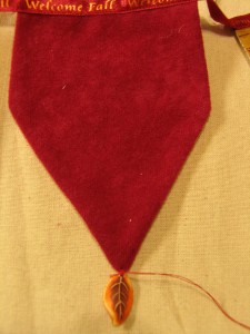 sew a little leaf on the tip of each flag