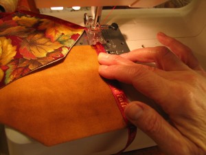 stitch flags onto ribbon