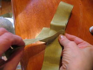 wrap ribbon around center and glue