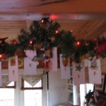 using a decorative hook hang a candy cane each day to mark the days till christmas