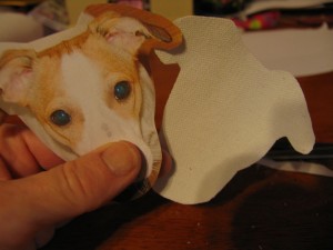 cut a piece of canvas fabric using your dogs face piece as a pattern