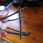 glue a piece of twig across the legs. This will make the legs sturdy