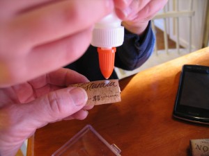 put a drop of glue into each of the holes you made