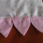 heart border at ends of scarf