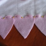 pin three hearts to each edge of scarf.