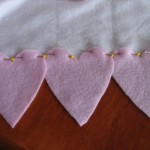 ;in three hearts across both ends of scarf