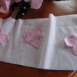 pin hearts on scarf as shown