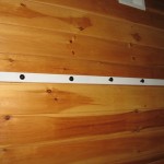 attach rail to wall using screws or nails