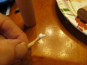 put a dab of glue on nose