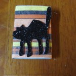 glue on black cat