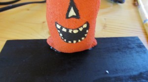 glue one pumpkin in center with hot glue