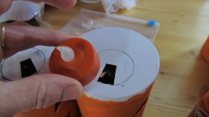 paint orange and then trace around salt hole to fit battery tea light