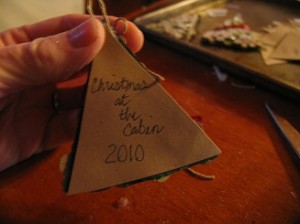 cut a piece of paper to put on back to cover ribbon ends and write on it