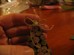 glue a little bow on the top of tree