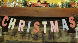 Christmas garland made from cardboard letters and scrapbook paper