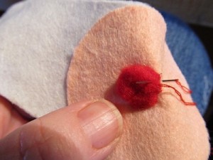 hand sew or glue nose on as shown
