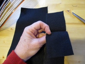 fold a piece of felt in half and cut. fold again and cut making 4 pieces