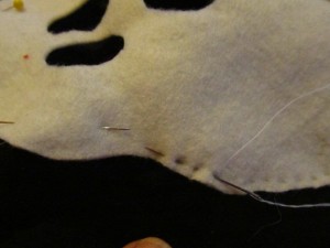 hand stitch, machine stitch or glue to front piece