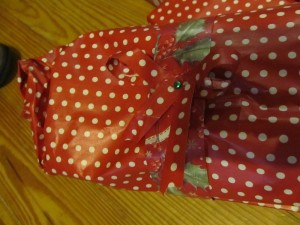 make a bow from narrow ribbon and use a paper fastener to secure the bow and to anchor to package
