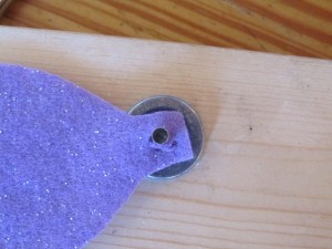 push the eyelet through the hole
