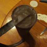 glue circle to bottom of can covering strap