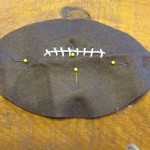 pin two footballs together leaving an opening in the bottom to stuff