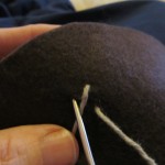 push needle through to make the first stitch