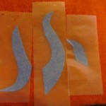 tape the pieces to the right color of felt.
